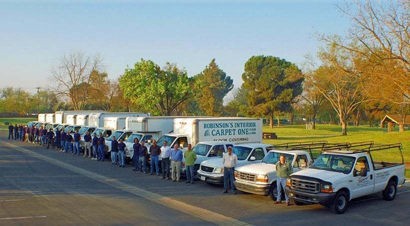 Robinson's Interior Fleet of Flooring Trucks With Crews Standing By